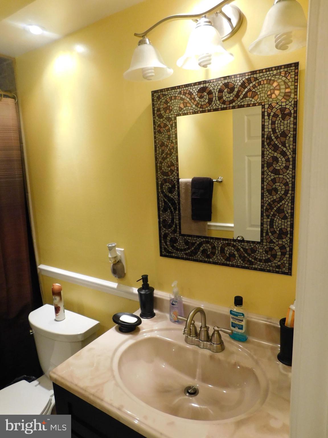 1333 Deanwood Road Baltimore, MD 21234 - Photo 28 of 40 a bathroom with a sink and a mirror