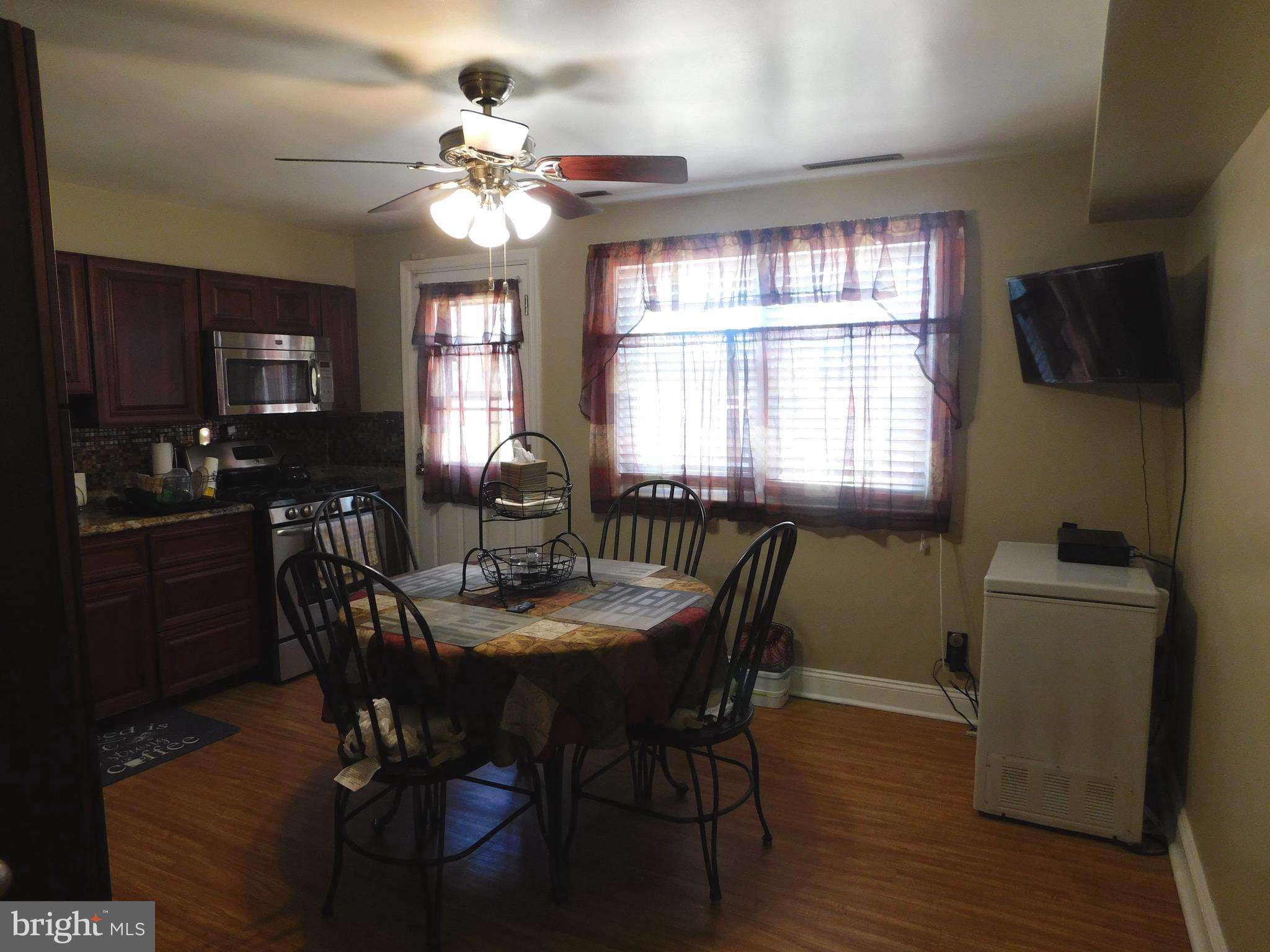 1333 Deanwood Road Baltimore, MD 21234 - Photo 5 of 40 a dining room with furniture a chandelier and window