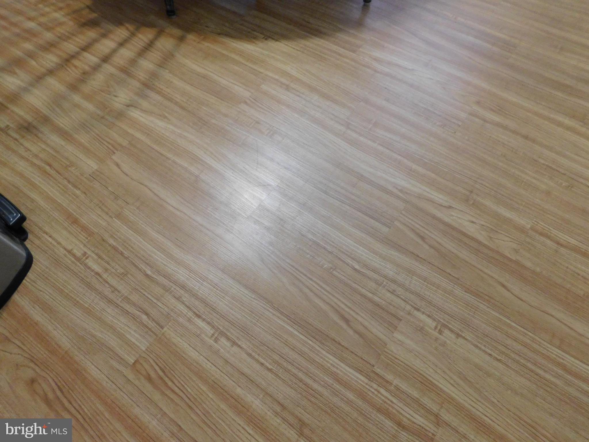 1333 Deanwood Road Baltimore, MD 21234 - Photo 6 of 40 an empty room with wooden floor and windows