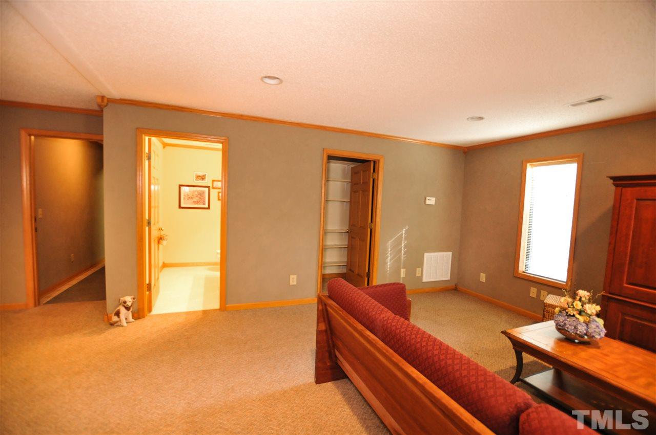 480 Benjie Williams Road Staley, NC 27355 - Photo 22 of 28 a living room with furniture