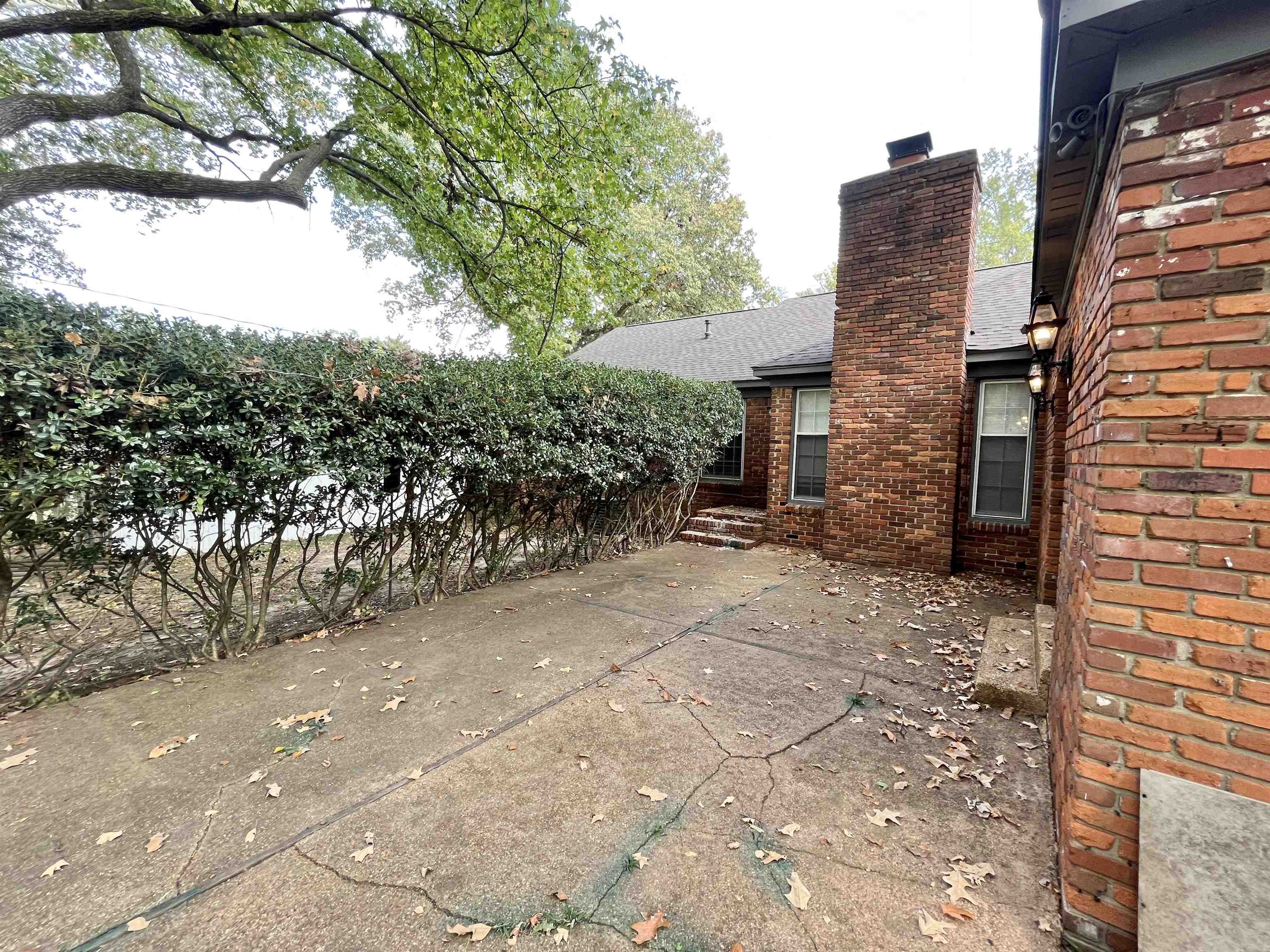 2973 Bannockburn Road Memphis, TN 38128 - Photo 21 of 26 a view of a pathway both side of house