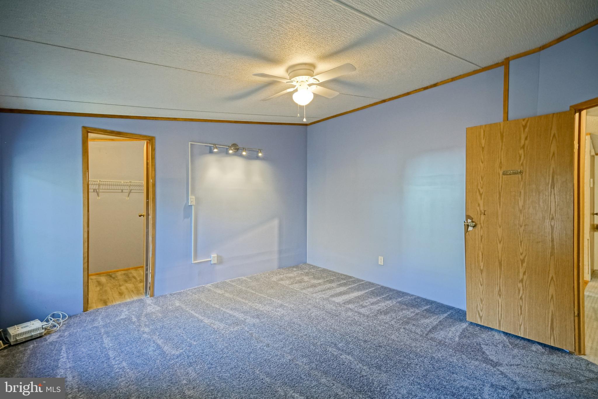 22916 Pine Road Lewes, DE 19958 - Photo 14 of 35 a view of a livingroom with a chandelier fan