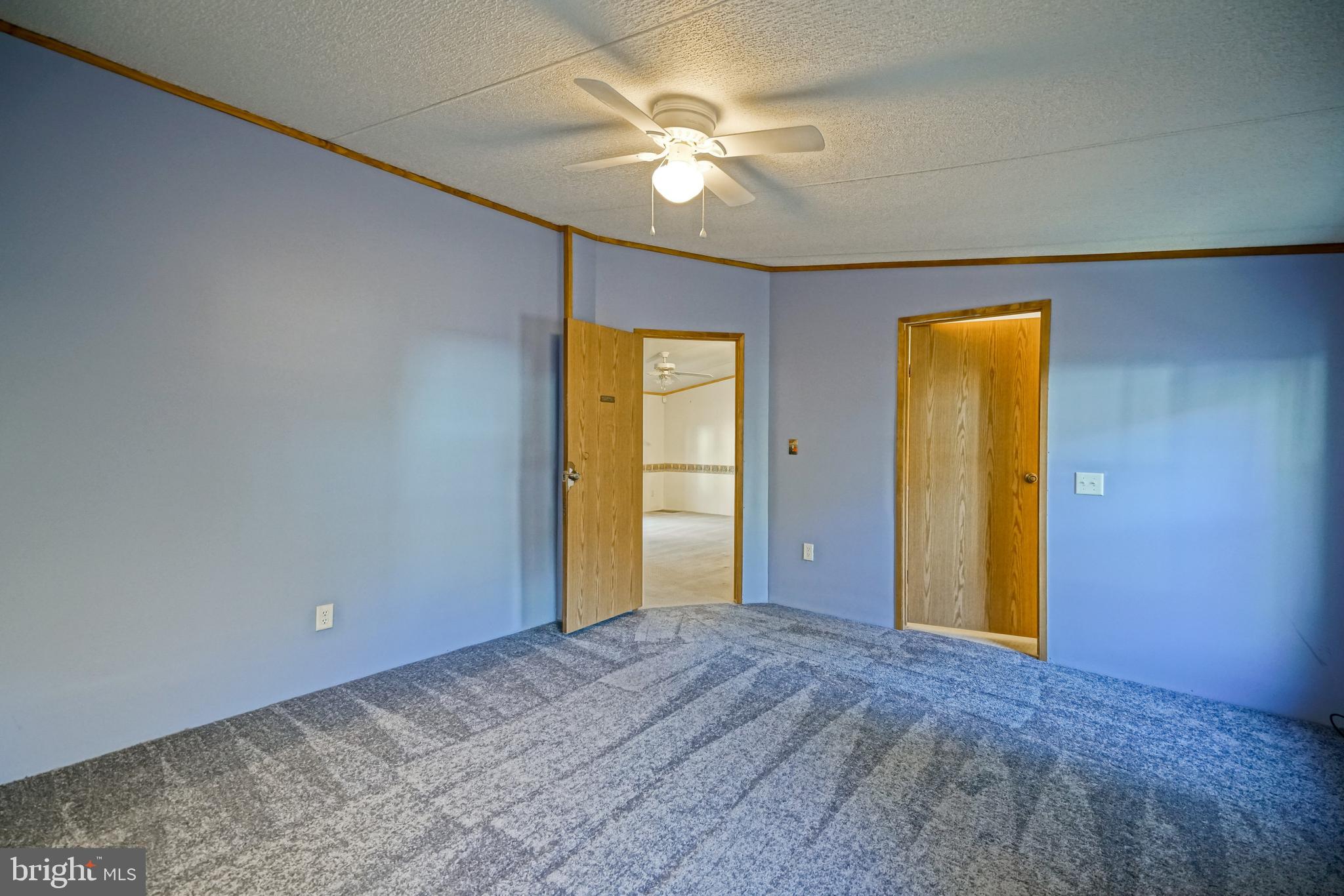 22916 Pine Road Lewes, DE 19958 - Photo 15 of 35 a view of a livingroom with a chandelier fan and a window