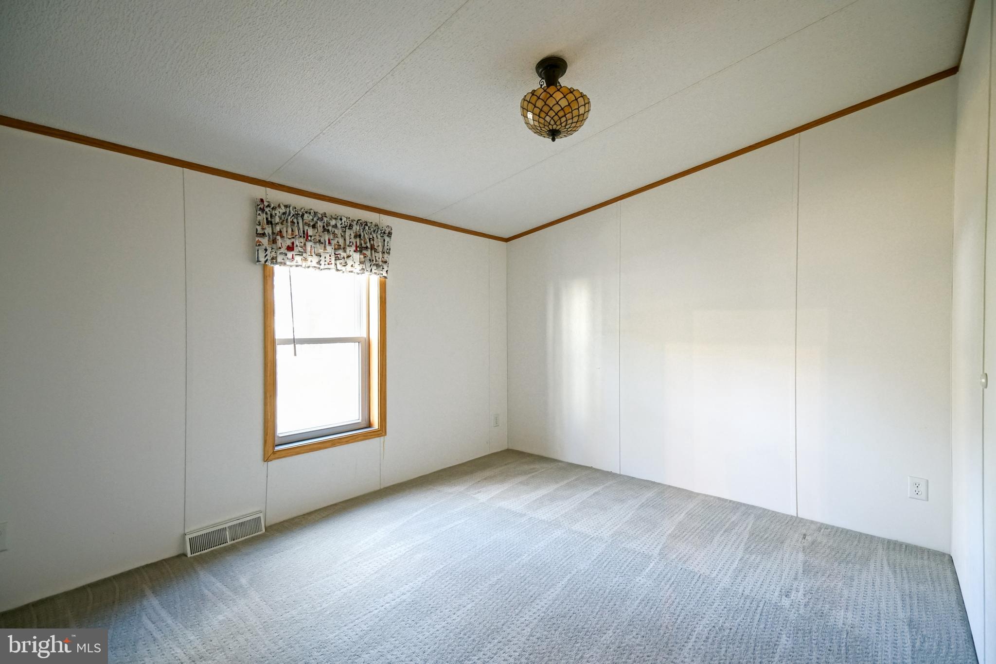 22916 Pine Road Lewes, DE 19958 - Photo 18 of 35 an empty room with a window