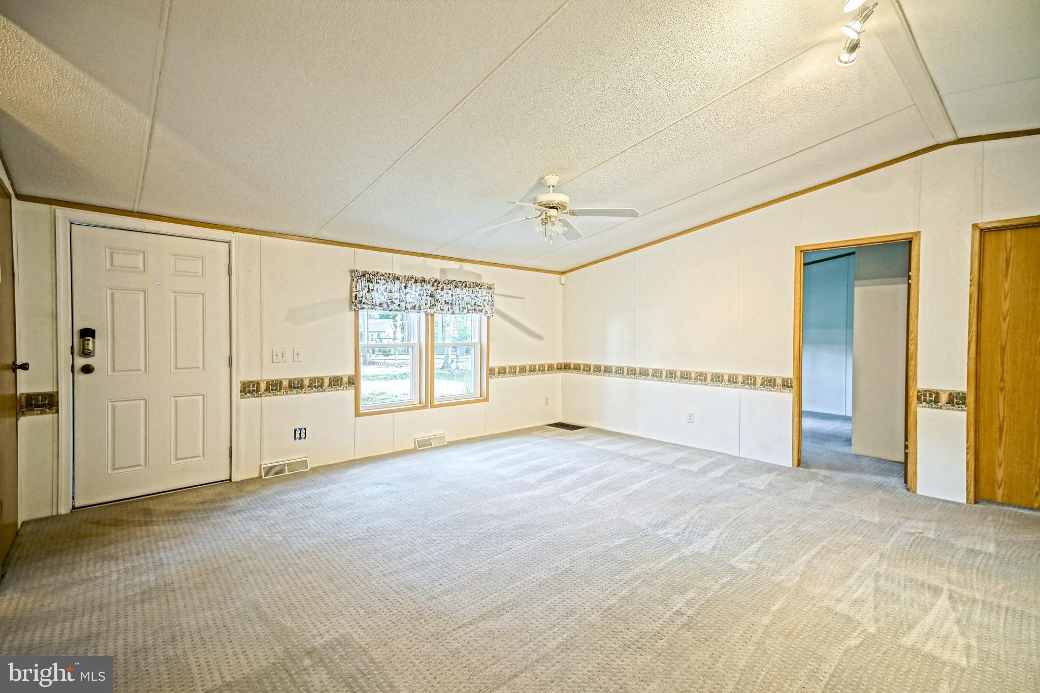 22916 Pine Road Lewes, DE 19958 - Photo 2 of 35 a view of an empty room with a window
