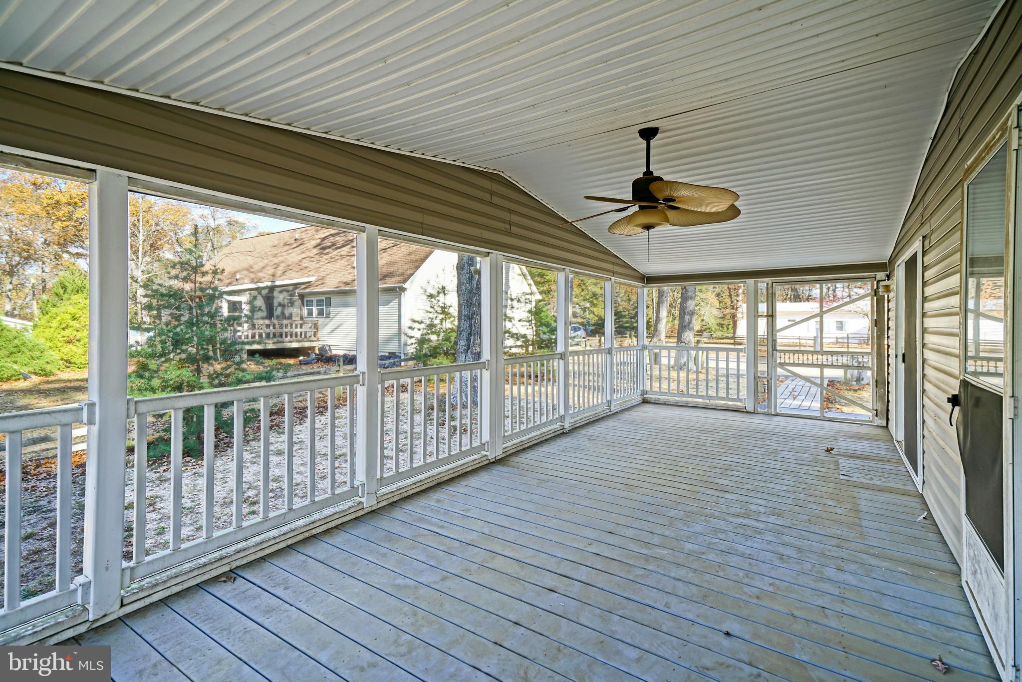22916 Pine Road Lewes, DE 19958 - Photo 23 of 35 a view of a porch with wooden floor