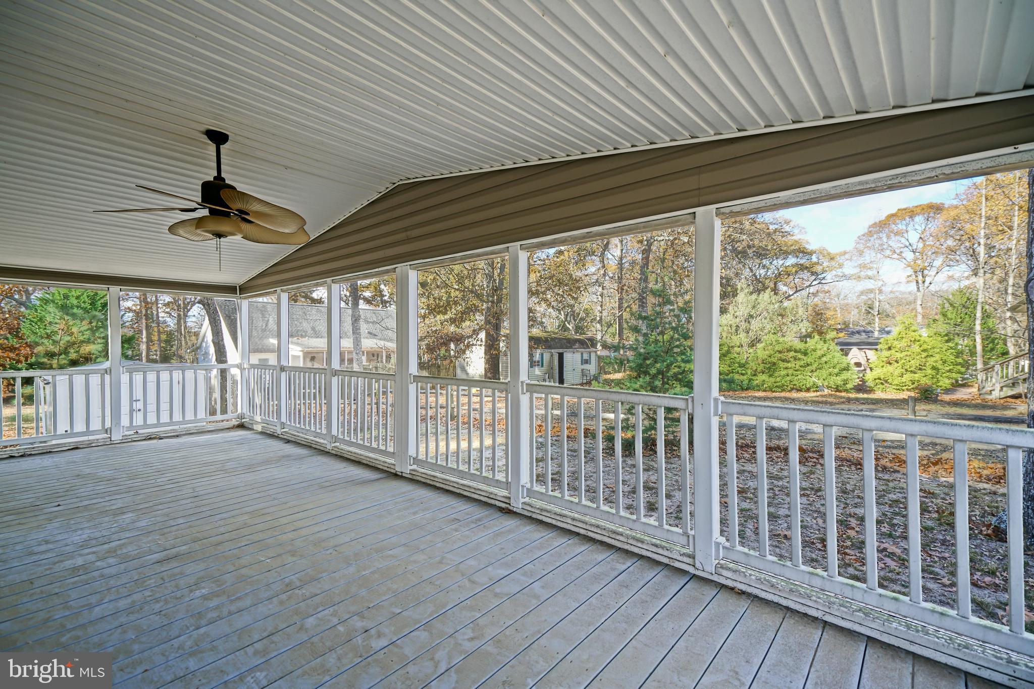 22916 Pine Road Lewes, DE 19958 - Photo 24 of 35 a view of a porch with wooden floor