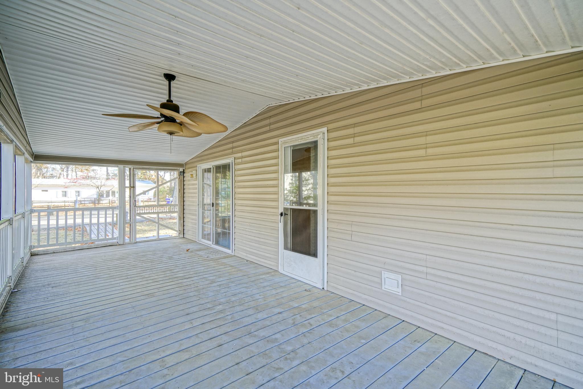 22916 Pine Road Lewes, DE 19958 - Photo 26 of 35 a view of empty room with wooden floor and fan
