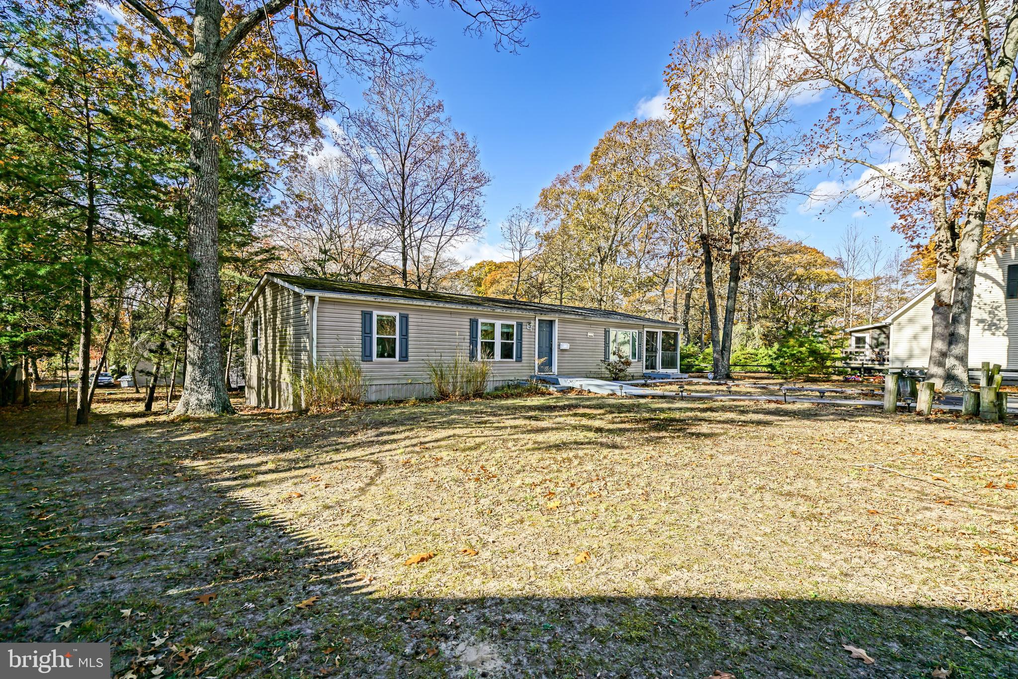 22916 Pine Road Lewes, DE 19958 - Photo 33 of 35 a front view of a house with a yard