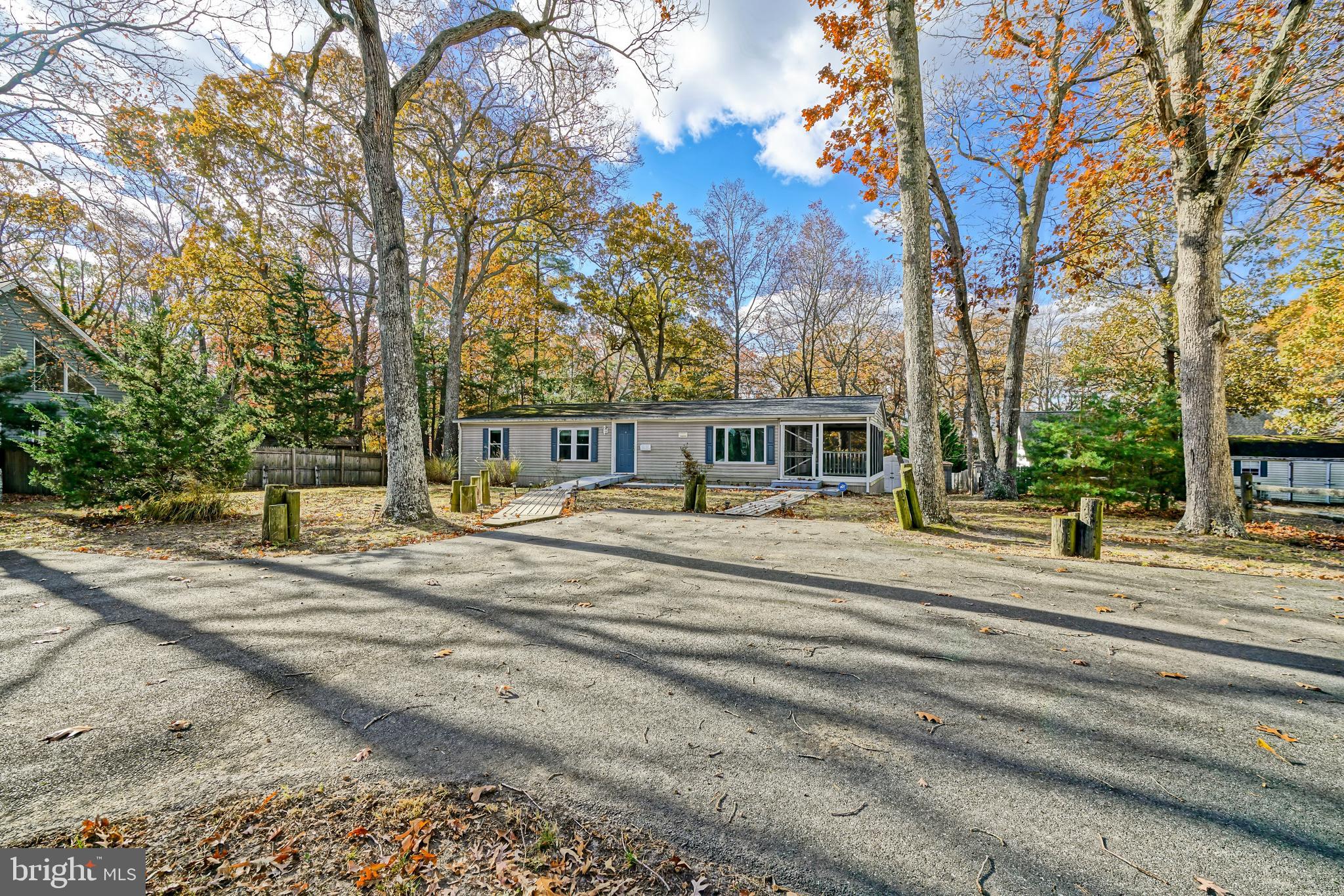 22916 Pine Road Lewes, DE 19958 - Photo 34 of 35 a view of a house with a yard