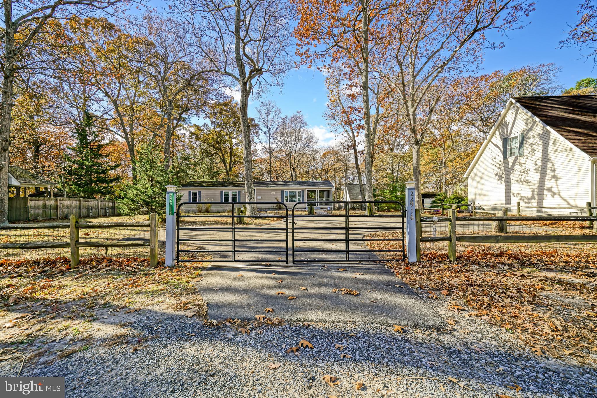22916 Pine Road Lewes, DE 19958 - Photo 35 of 35 a view of a yard with wooden fence