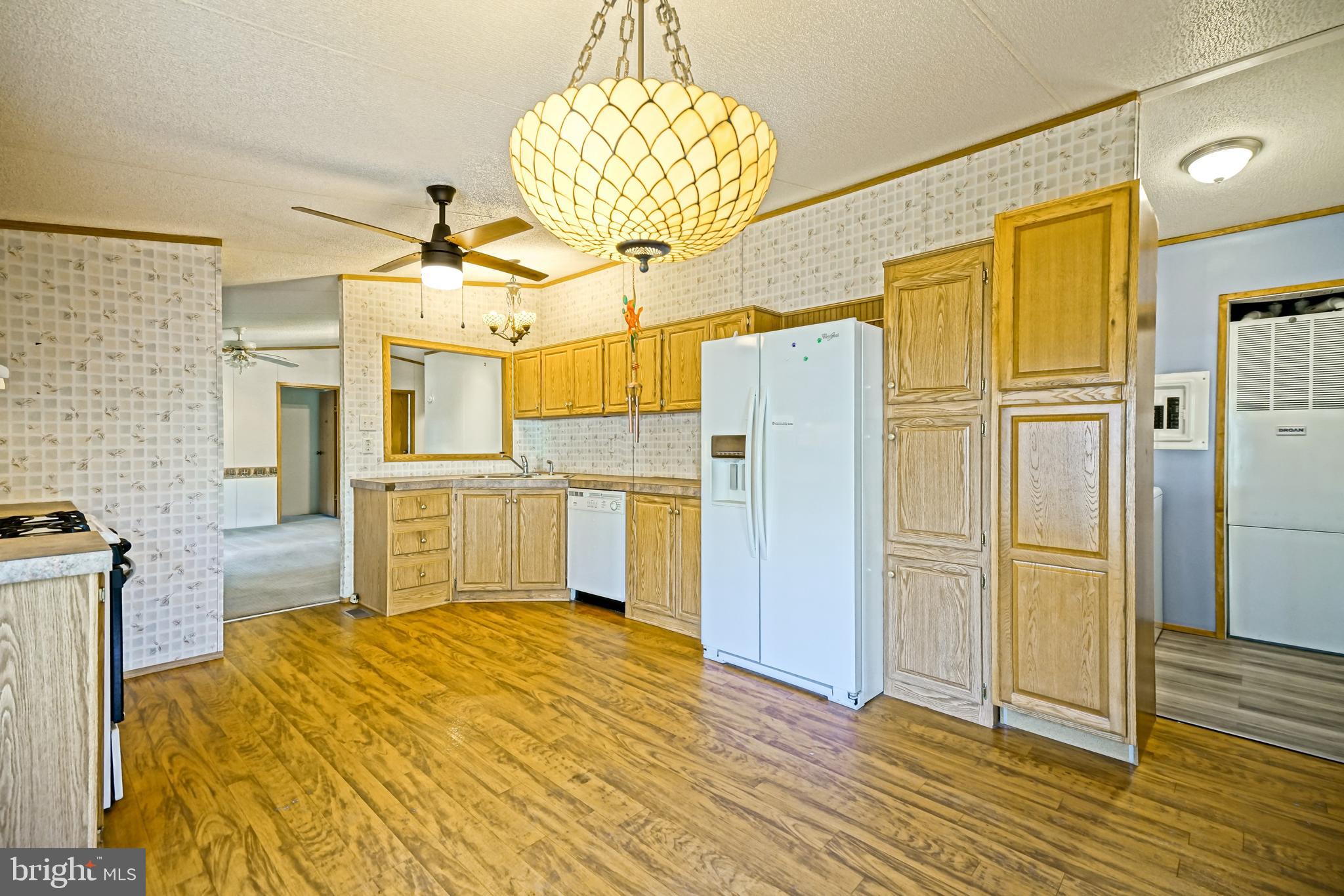 22916 Pine Road Lewes, DE 19958 - Photo 8 of 35 a bedroom with a bed and wooden floor