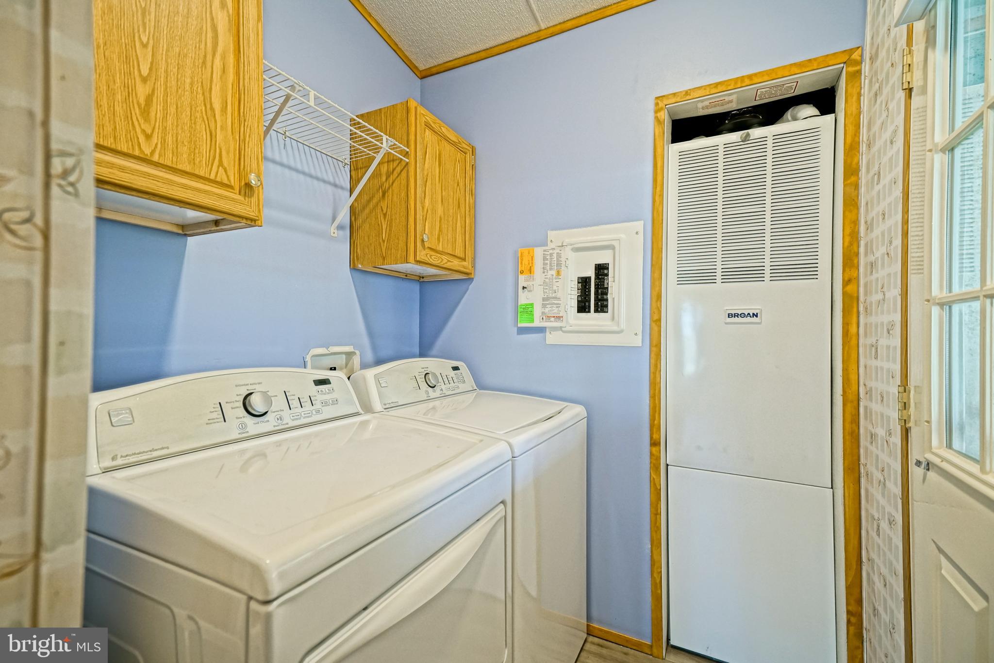 22916 Pine Road Lewes, DE 19958 - Photo 9 of 35 a utility room with dryer and washer