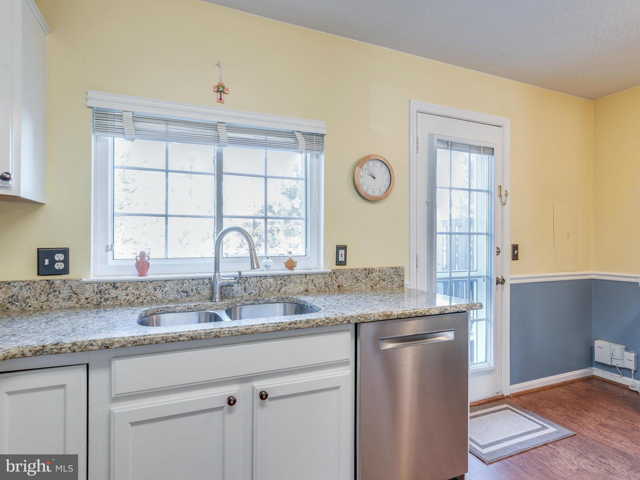2471 Fox Trot Terrace Reston, VA 20191 - Photo 9 of 23 Light Filled Kitchen w/ exit to back yard