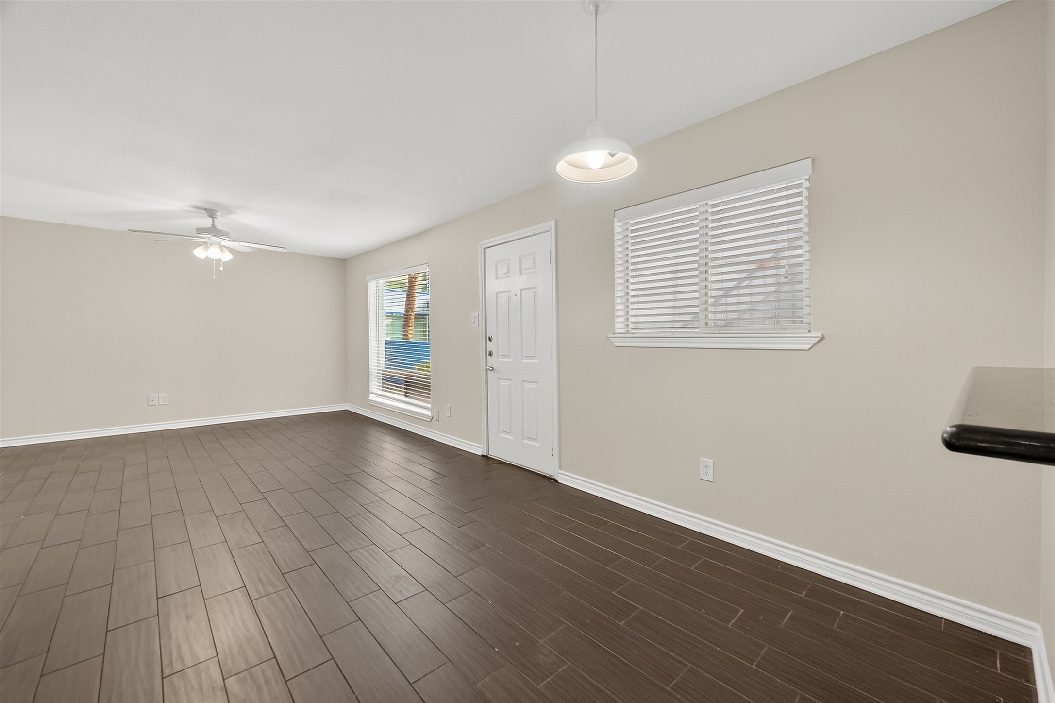 2020 Huldy Street, Unit 2 Houston, TX 77019 - Photo 16 of 34 an empty room with wooden floor and windows