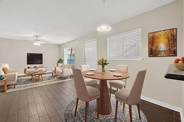 a view of a dining room with furniture and wooden floor