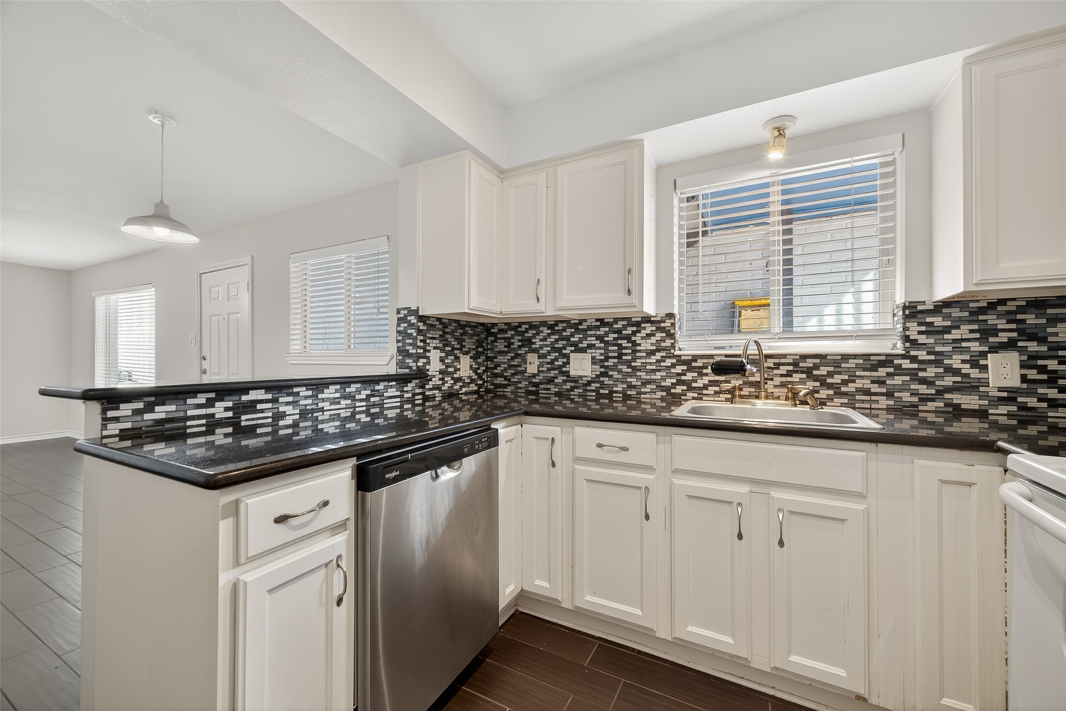 2020 Huldy Street, Unit 2 Houston, TX 77019 - Photo 19 of 34 a kitchen with granite countertop a sink stove and cabinets