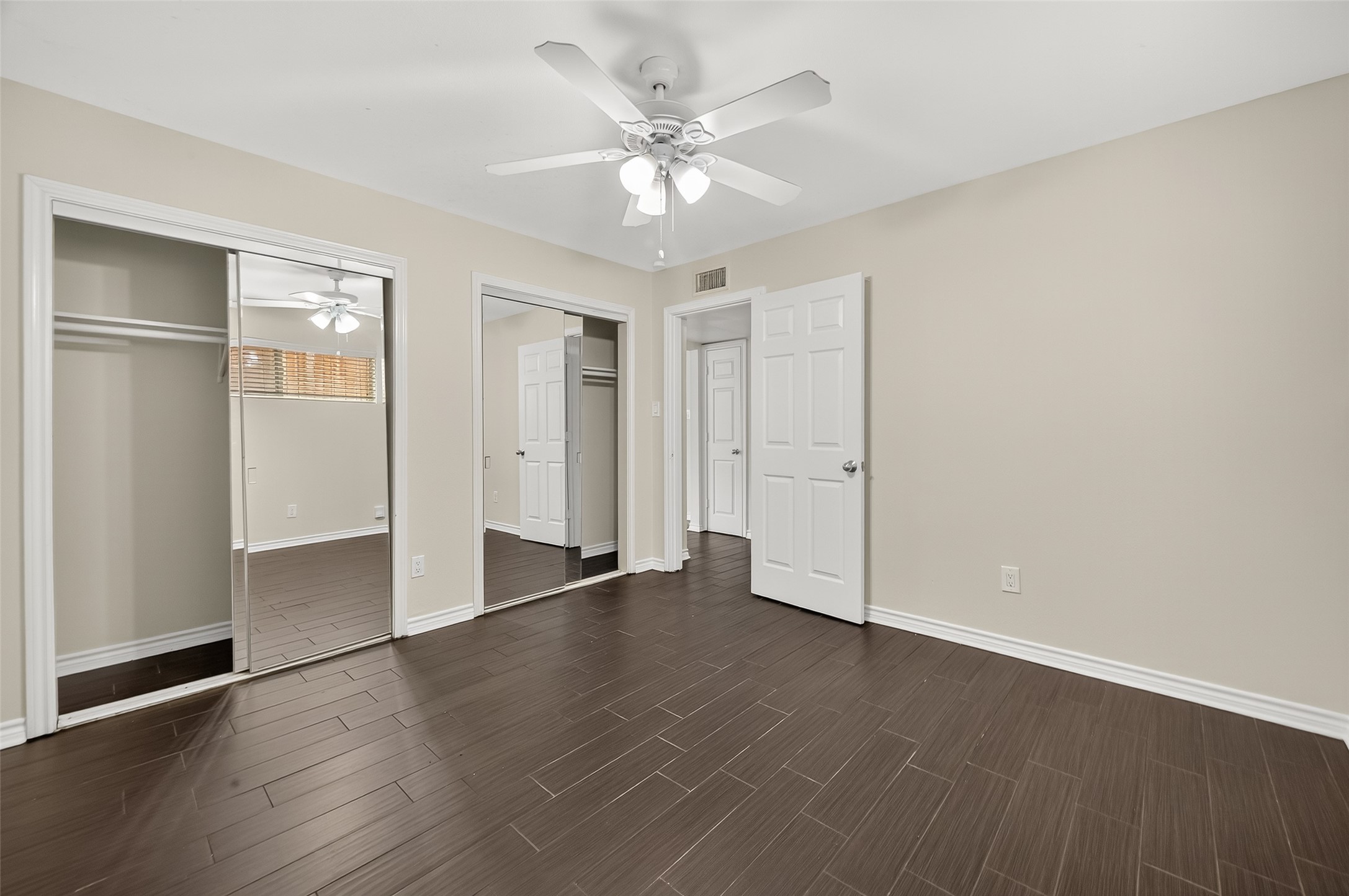 2020 Huldy Street, Unit 2 Houston, TX 77019 - Photo 27 of 34 an empty room with wooden floor closet and windows
