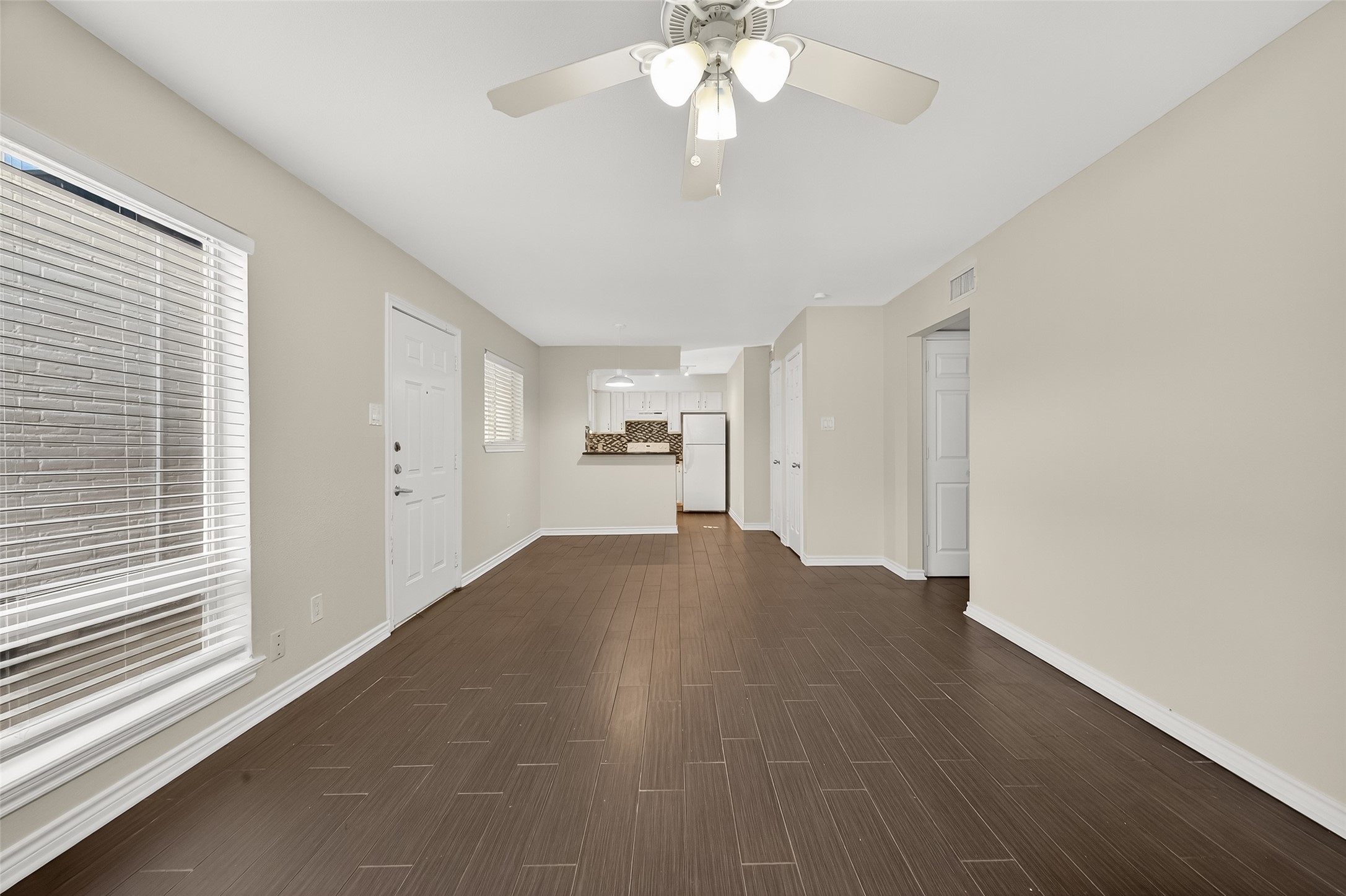 2020 Huldy Street, Unit 2 Houston, TX 77019 - Photo 9 of 34 a view of empty room with wooden floor and fan