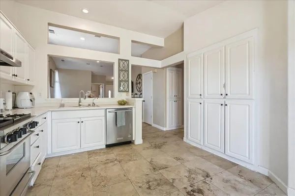 a view of a kitchen with a sink