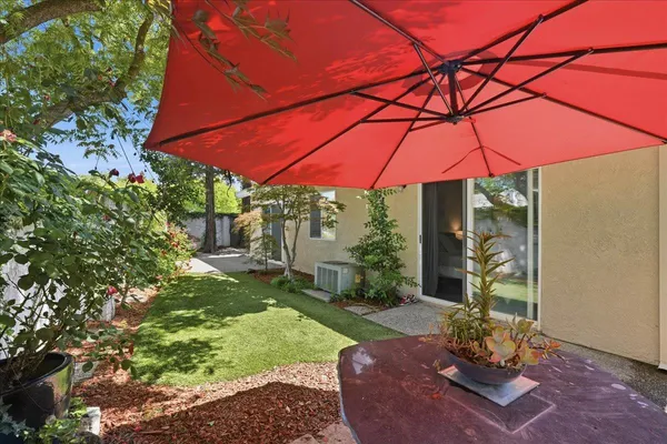 a view of a backyard with sitting area