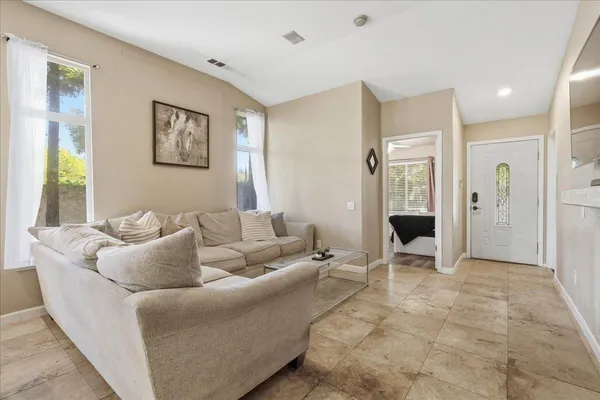 a living room with furniture and a area