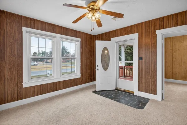 a big house with a big yard and large trees