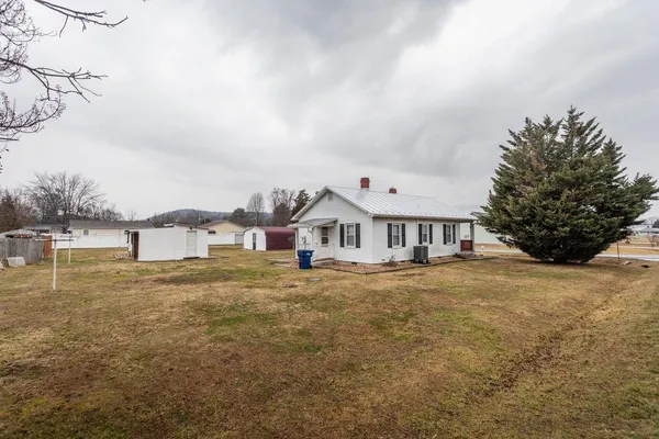 a view of a house with a street