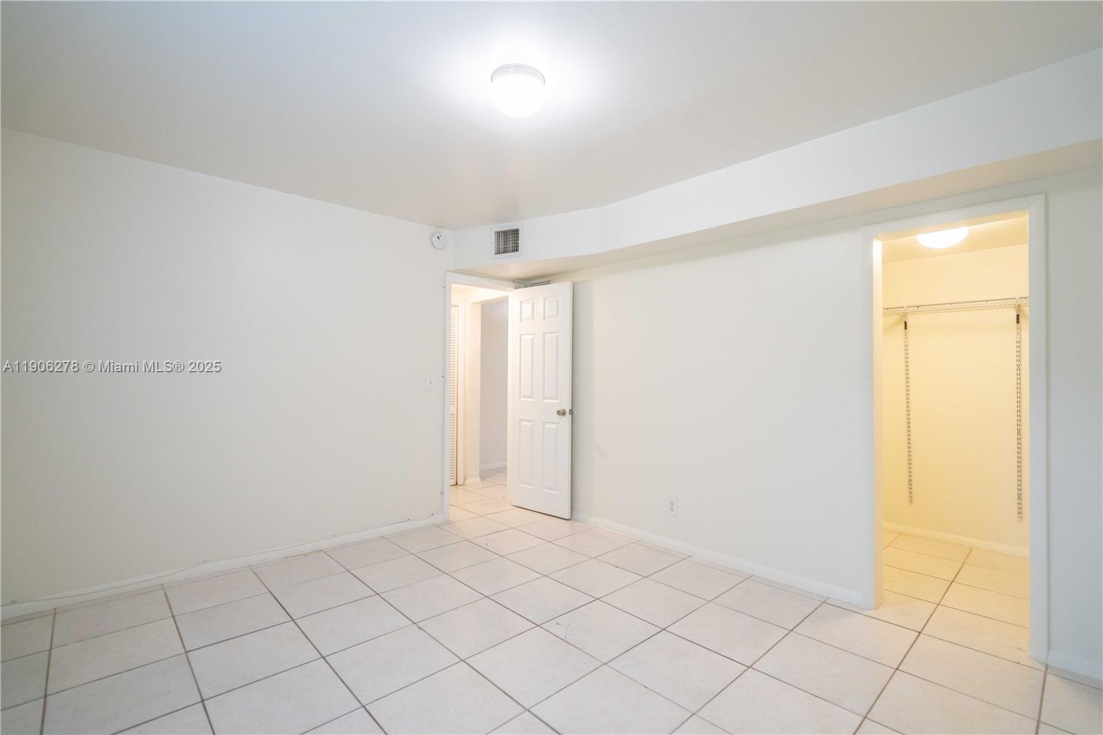 666 Northeast 80th Street, Unit 9 Miami, FL 33138 - Photo 11 of 16 a view of an empty room and window
