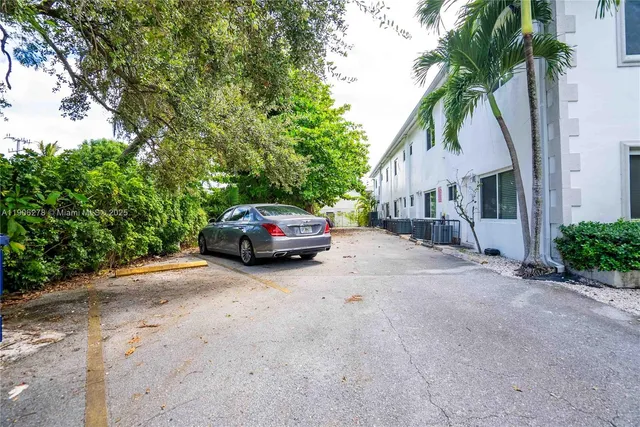 a view of a car parked in front of a house