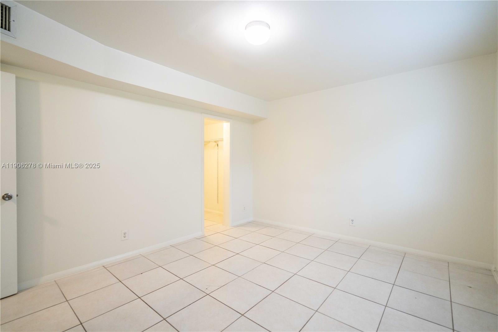 666 Northeast 80th Street, Unit 9 Miami, FL 33138 - Photo 10 of 16 a view of an empty room