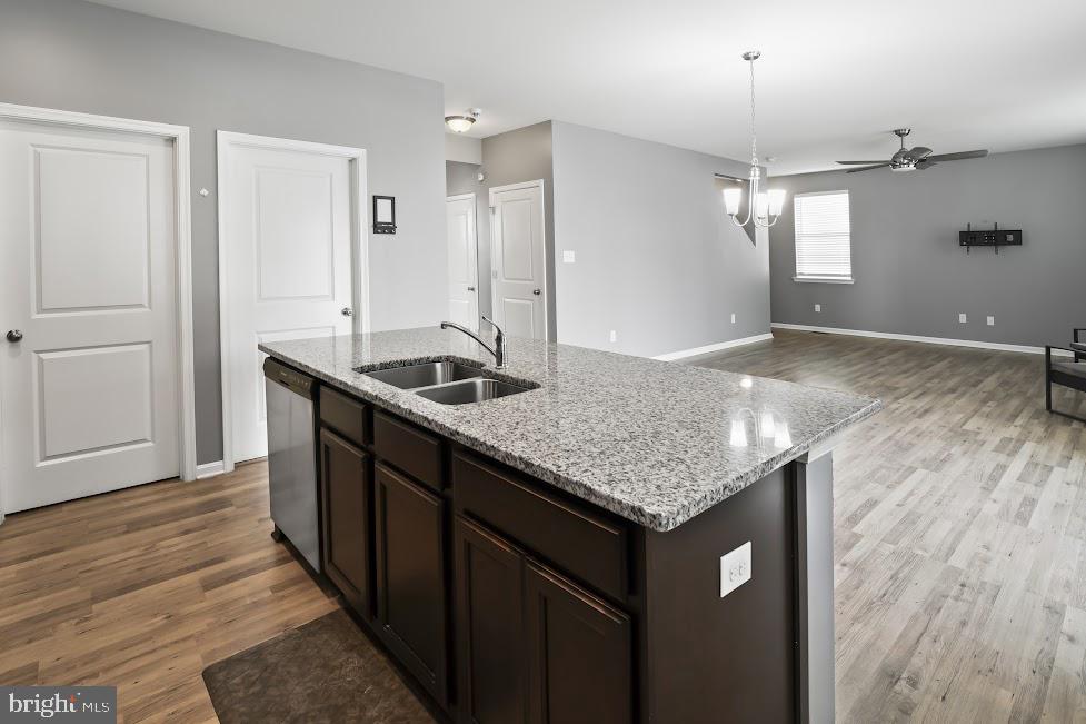 705 Beechwood Drive Deptford, NJ 08096 - Photo 17 of 39 a kitchen with sink cabinets and wooden floor