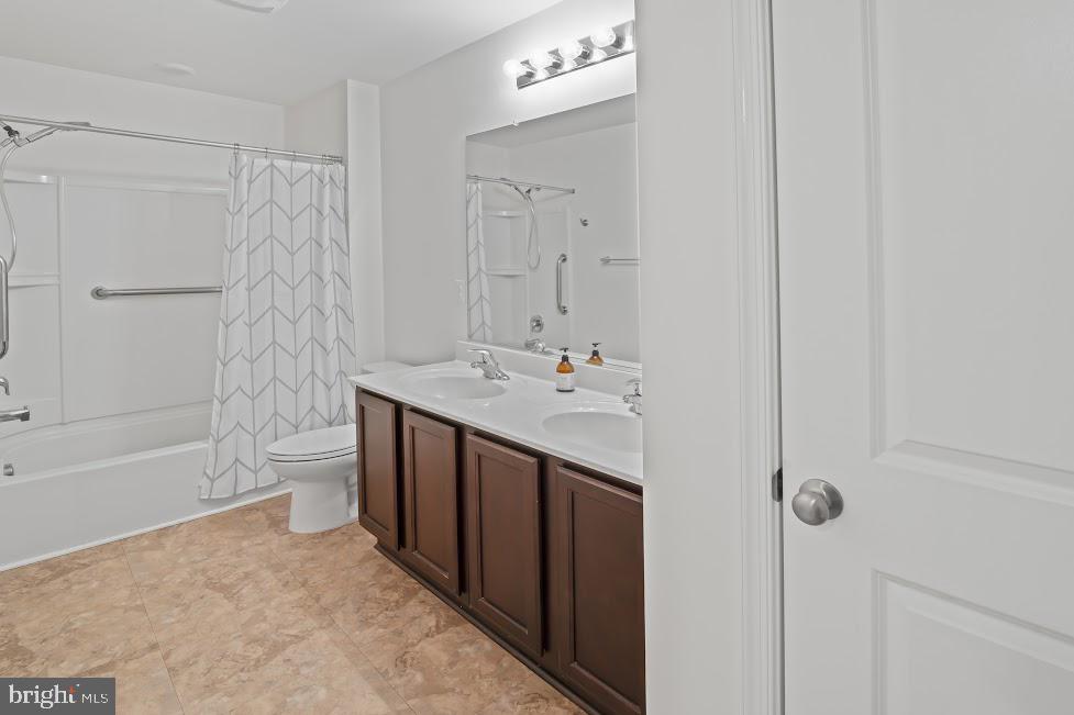 705 Beechwood Drive Deptford, NJ 08096 - Photo 30 of 39 a bathroom with a double vanity sink toilet and shower
