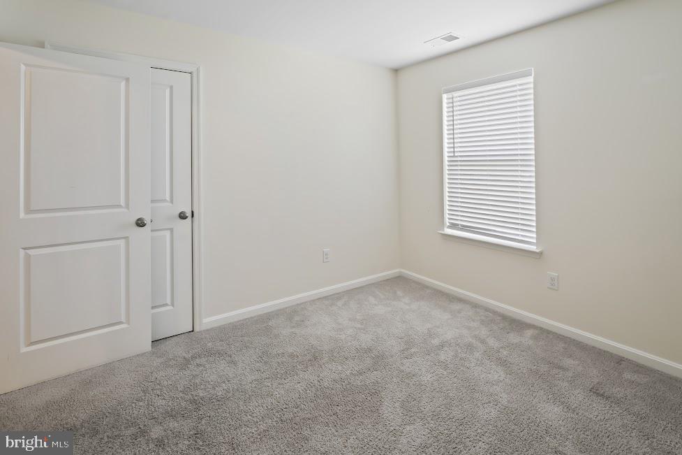 705 Beechwood Drive Deptford, NJ 08096 - Photo 31 of 39 an empty room with windows