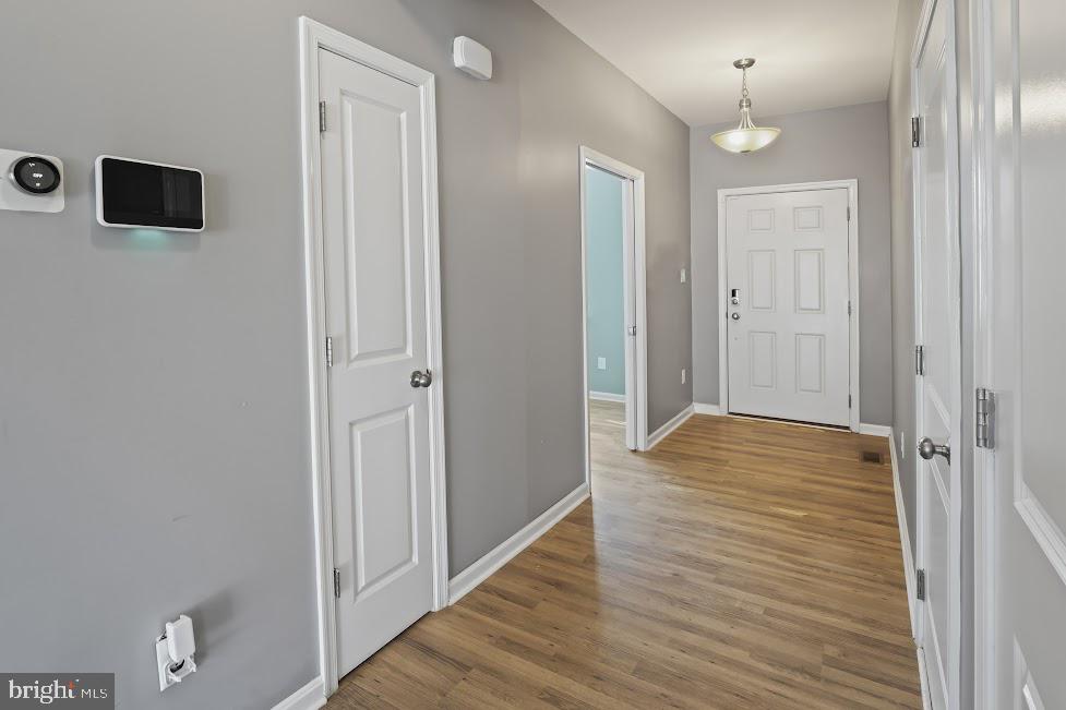 705 Beechwood Drive Deptford, NJ 08096 - Photo 5 of 39 a view of a hallway with wooden floor