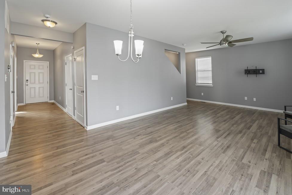 705 Beechwood Drive Deptford, NJ 08096 - Photo 8 of 39 an empty room with wooden floor and windows