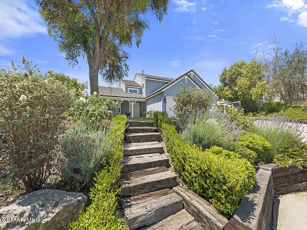 1902 Rambling Road Simi Valley, CA 93065 - Photo 18 of 67 a front view of a house with a yard