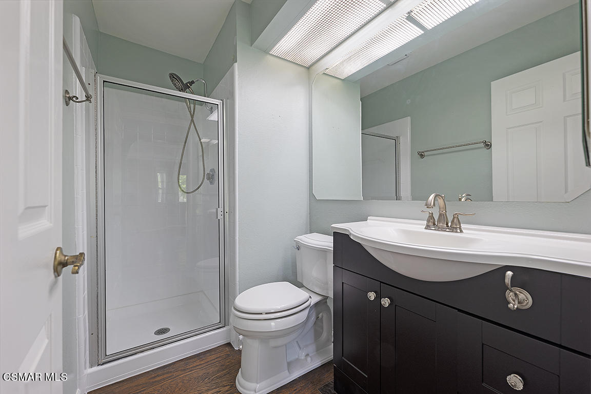 1902 Rambling Road Simi Valley, CA 93065 - Photo 24 of 67 a bathroom with a sink a toilet a mirror and shower