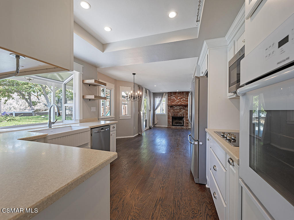 1902 Rambling Road Simi Valley, CA 93065 - Photo 33 of 67 a kitchen with stainless steel appliances granite countertop a refrigerator a sink and a stove