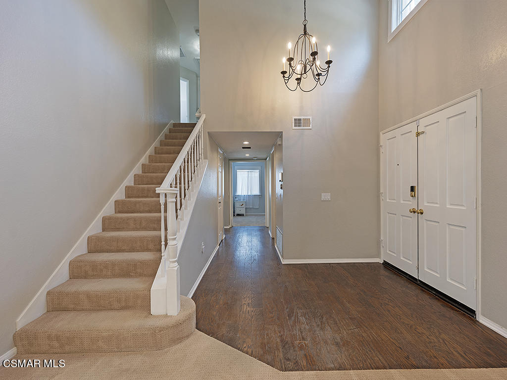 1902 Rambling Road Simi Valley, CA 93065 - Photo 41 of 67 a view of a hallway with wooden floor and staircase
