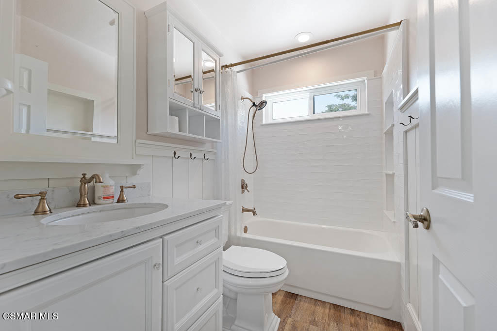 1902 Rambling Road Simi Valley, CA 93065 - Photo 45 of 67 a bathroom with a granite countertop sink a toilet and shower