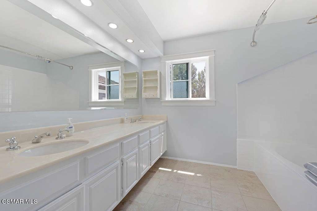 1902 Rambling Road Simi Valley, CA 93065 - Photo 51 of 67 a spacious bathroom with 2 sink tub and a mirror