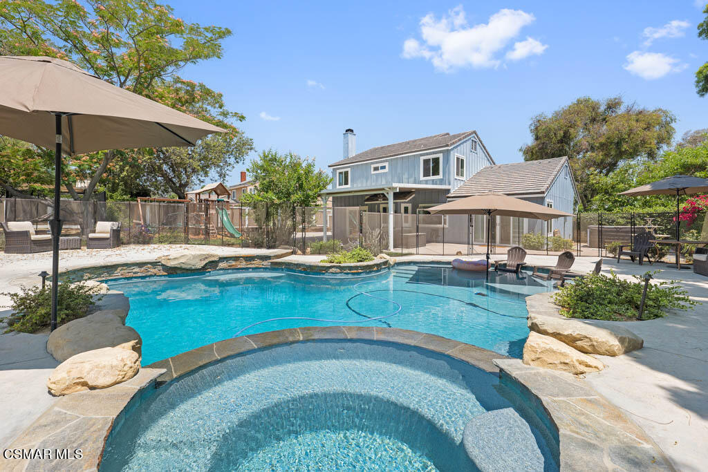 1902 Rambling Road Simi Valley, CA 93065 - Photo 62 of 67 a swimming pool with outdoor seating and yard
