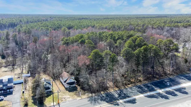 an aerial view of residential house with outdoor space