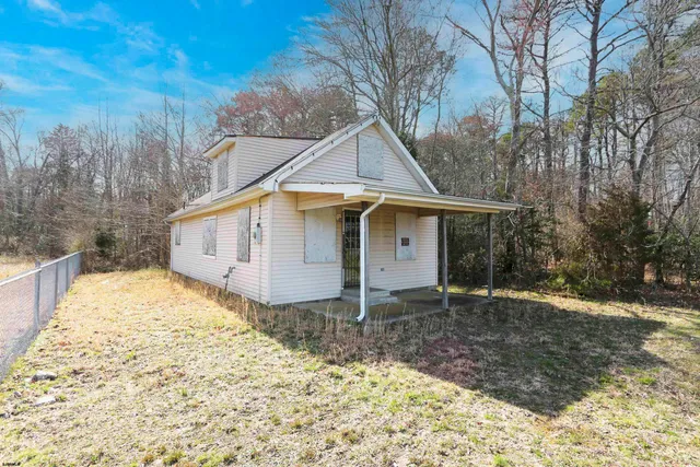 a house with yard in front of it
