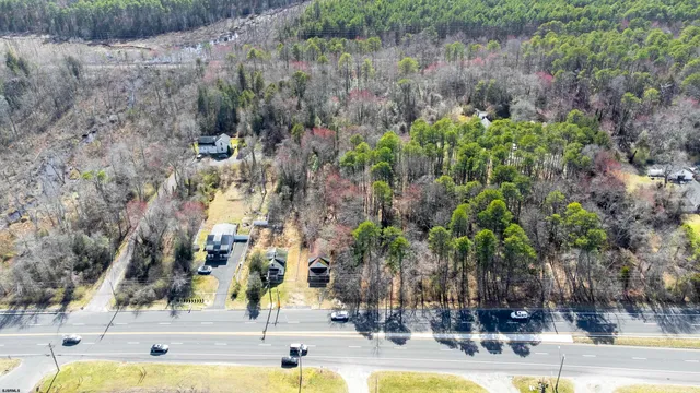 a view of lake with residential houses with outdoor space and trees