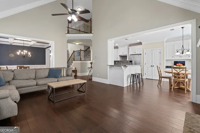 a kitchen with white cabinets and appliances