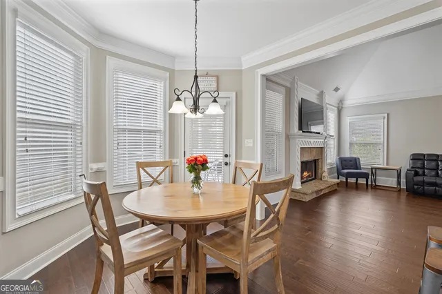 a kitchen with granite countertop white cabinets stainless steel appliances and sink