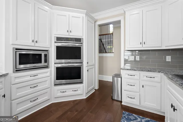 a bedroom with a bed and a television