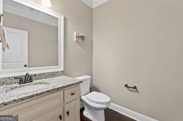 a bedroom with a bed and a television